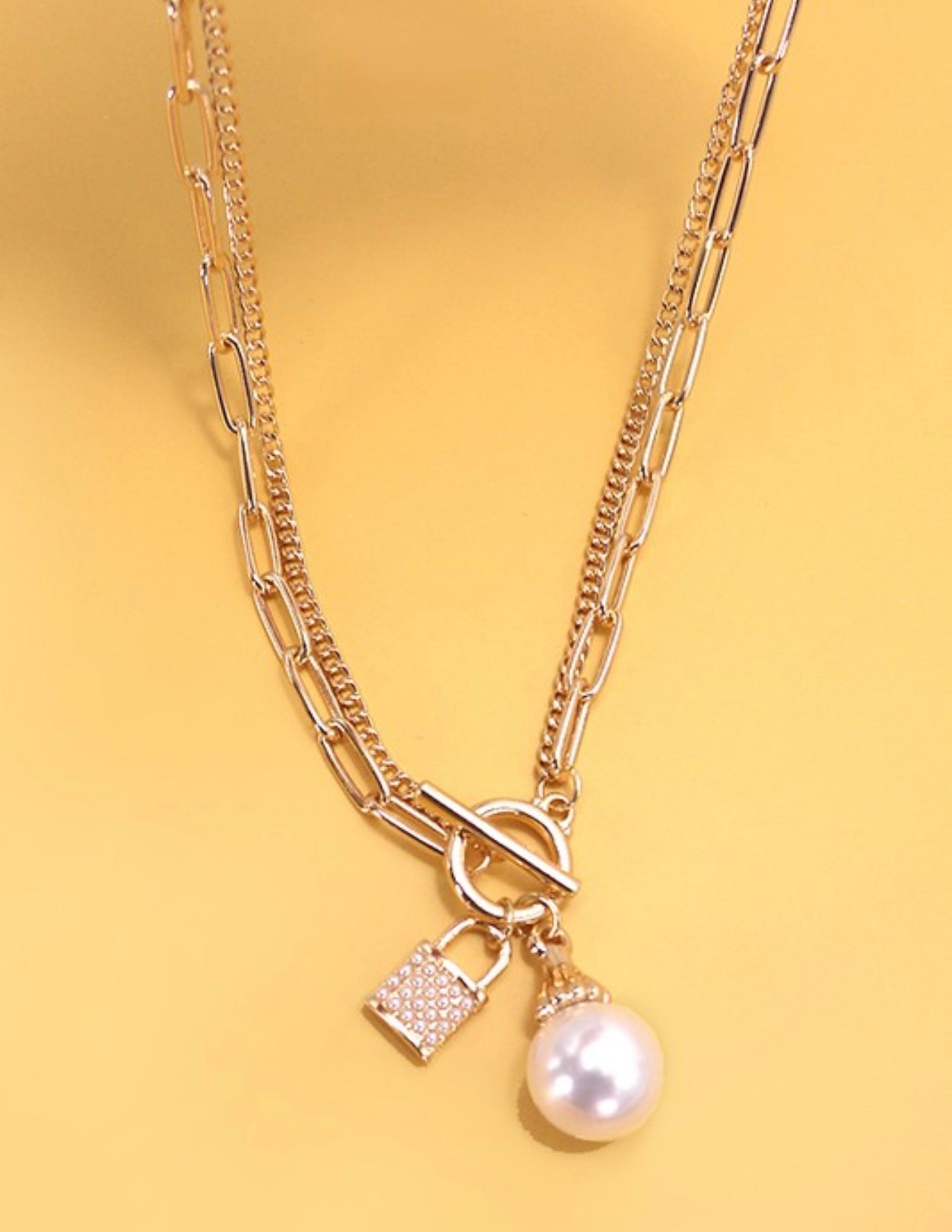 Pearl & lock charm necklace